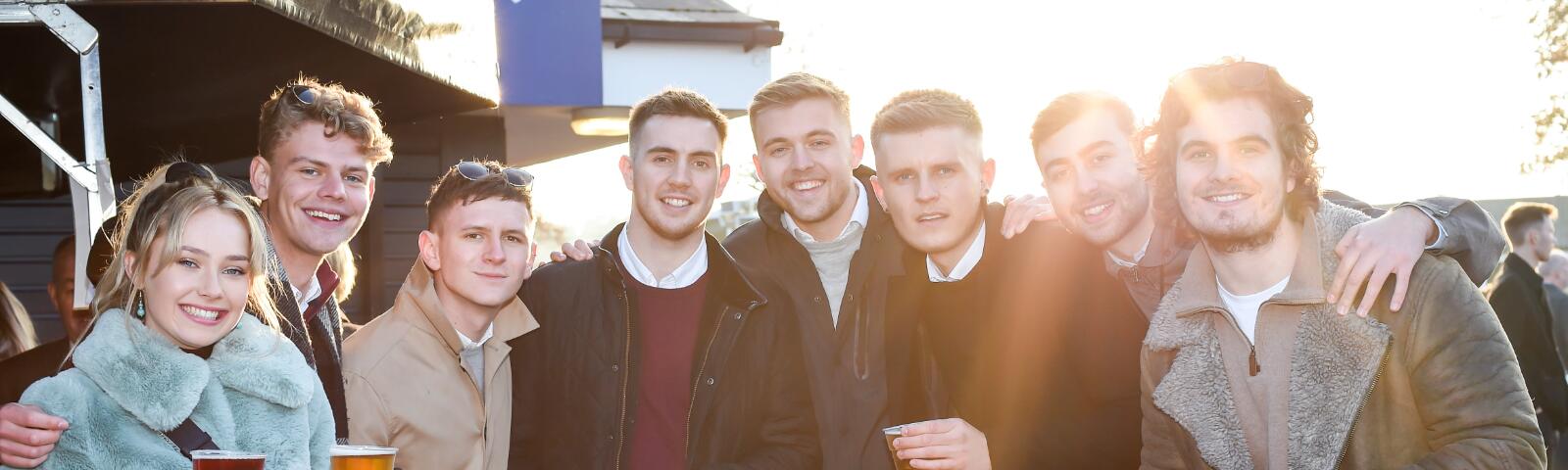 A large group of friends enjoy the races at Fontwell Park