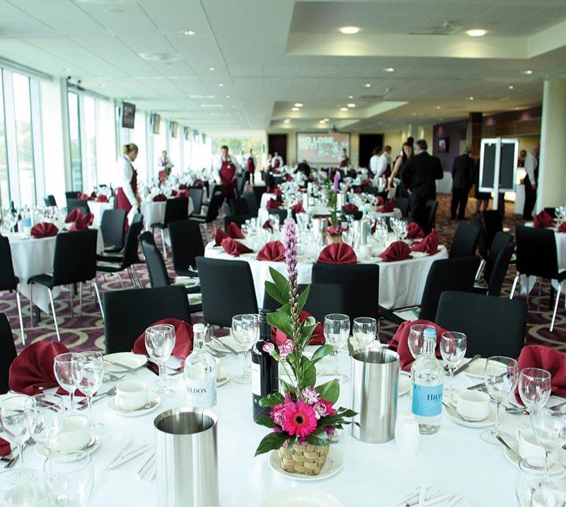 Stunningly prepared dining tables getting the final checkover from staff before the guests arrive.