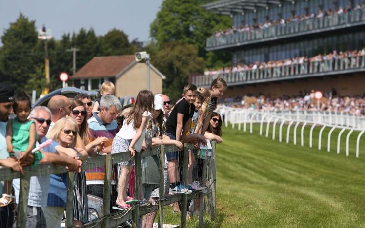 families enjoying the racing at family fun day